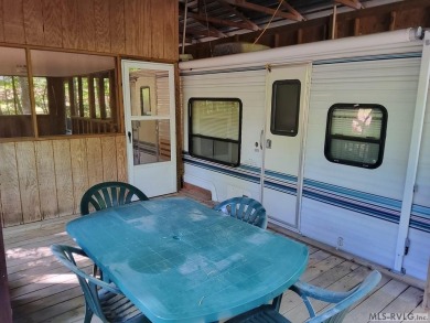 Nice size lot with parking area. 1995 Camper has stick built on River Ridge Golf Club in Virginia - for sale on GolfHomes.com, golf home, golf lot