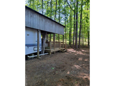 Nice size lot with parking area. 1995 Camper has stick built on River Ridge Golf Club in Virginia - for sale on GolfHomes.com, golf home, golf lot