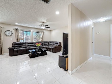 Welcome to this spacious 4-bedroom, 2-bathroom corner-unit villa on East Lake Woodlands Country Club in Florida - for sale on GolfHomes.com, golf home, golf lot