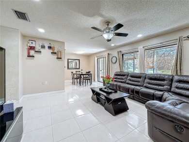 Welcome to this spacious 4-bedroom, 2-bathroom corner-unit villa on East Lake Woodlands Country Club in Florida - for sale on GolfHomes.com, golf home, golf lot