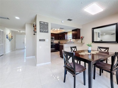 Welcome to this spacious 4-bedroom, 2-bathroom corner-unit villa on East Lake Woodlands Country Club in Florida - for sale on GolfHomes.com, golf home, golf lot