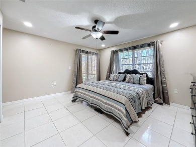 Welcome to this spacious 4-bedroom, 2-bathroom corner-unit villa on East Lake Woodlands Country Club in Florida - for sale on GolfHomes.com, golf home, golf lot