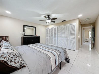 Welcome to this spacious 4-bedroom, 2-bathroom corner-unit villa on East Lake Woodlands Country Club in Florida - for sale on GolfHomes.com, golf home, golf lot