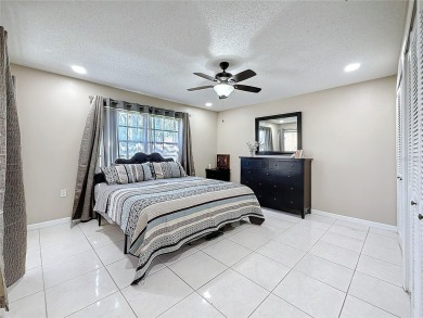 Welcome to this spacious 4-bedroom, 2-bathroom corner-unit villa on East Lake Woodlands Country Club in Florida - for sale on GolfHomes.com, golf home, golf lot