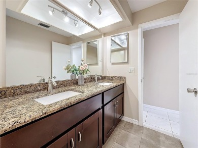 Welcome to this spacious 4-bedroom, 2-bathroom corner-unit villa on East Lake Woodlands Country Club in Florida - for sale on GolfHomes.com, golf home, golf lot