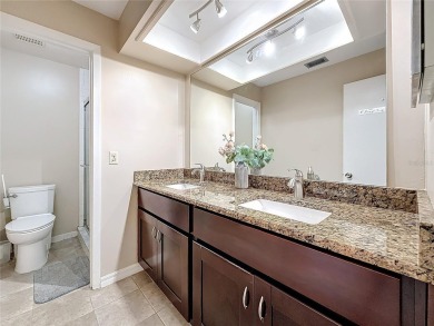 Welcome to this spacious 4-bedroom, 2-bathroom corner-unit villa on East Lake Woodlands Country Club in Florida - for sale on GolfHomes.com, golf home, golf lot