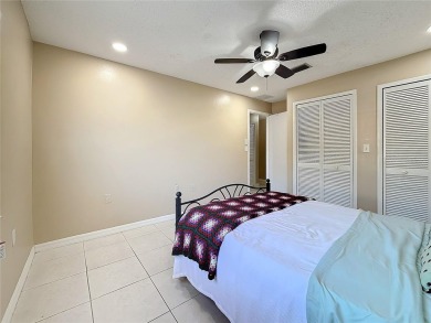 Welcome to this spacious 4-bedroom, 2-bathroom corner-unit villa on East Lake Woodlands Country Club in Florida - for sale on GolfHomes.com, golf home, golf lot