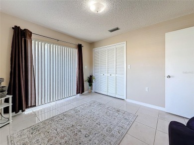 Welcome to this spacious 4-bedroom, 2-bathroom corner-unit villa on East Lake Woodlands Country Club in Florida - for sale on GolfHomes.com, golf home, golf lot