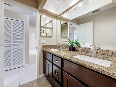 Welcome to this spacious 4-bedroom, 2-bathroom corner-unit villa on East Lake Woodlands Country Club in Florida - for sale on GolfHomes.com, golf home, golf lot