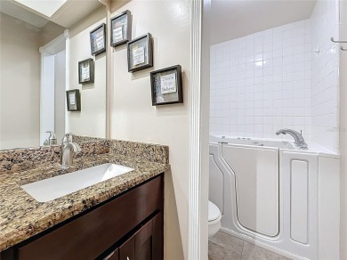 Welcome to this spacious 4-bedroom, 2-bathroom corner-unit villa on East Lake Woodlands Country Club in Florida - for sale on GolfHomes.com, golf home, golf lot