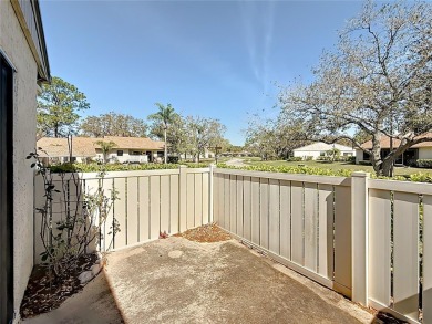 Welcome to this spacious 4-bedroom, 2-bathroom corner-unit villa on East Lake Woodlands Country Club in Florida - for sale on GolfHomes.com, golf home, golf lot