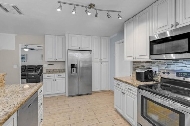 Welcome to Jacaranda West! This updated 3-bedroom, 2-bath pool on Jacaranda West Country Club in Florida - for sale on GolfHomes.com, golf home, golf lot