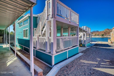 Set along the scenic Colorado River, this bungalow at Roadrunner on Emerald Canyon Golf Course in Arizona - for sale on GolfHomes.com, golf home, golf lot