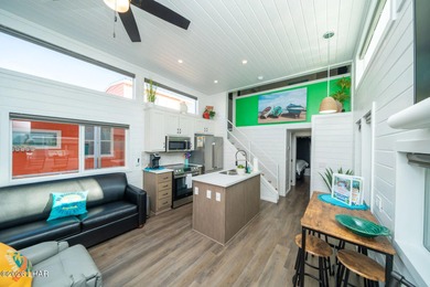 Set along the scenic Colorado River, this bungalow at Roadrunner on Emerald Canyon Golf Course in Arizona - for sale on GolfHomes.com, golf home, golf lot