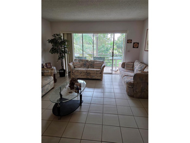 Spacious 2-bedroom, 2-bathroom second-floor condo located in a on Colony West Country Club in Florida - for sale on GolfHomes.com, golf home, golf lot