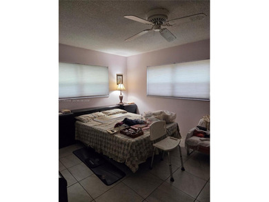 Spacious 2-bedroom, 2-bathroom second-floor condo located in a on Colony West Country Club in Florida - for sale on GolfHomes.com, golf home, golf lot