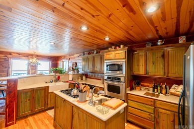 LAKEFRONT! Custom built in 2005, this beautiful log home is your on  in Arkansas - for sale on GolfHomes.com, golf home, golf lot