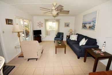 Rarely available ground floor end unit. Easy access to Sharkey's on Lake Venice Golf Club in Florida - for sale on GolfHomes.com, golf home, golf lot