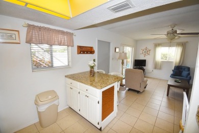 Rarely available ground floor end unit. Easy access to Sharkey's on Lake Venice Golf Club in Florida - for sale on GolfHomes.com, golf home, golf lot