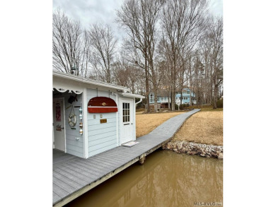 Discover unparalleled lakefront living in the coveted Tanglewood on Tanglewood Shores Golf Club in Virginia - for sale on GolfHomes.com, golf home, golf lot