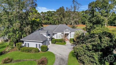 Enjoy panoramic golf course and lagoon views from this beautiful on The Landings Club - Oakridge in Georgia - for sale on GolfHomes.com, golf home, golf lot