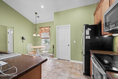 Experience the perfect blend of comfort and golf course living on Meadowlands Golf Club in North Carolina - for sale on GolfHomes.com, golf home, golf lot