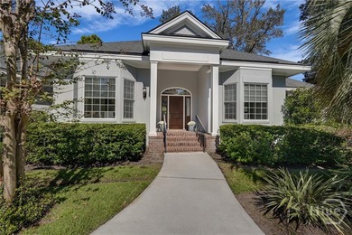 Enjoy panoramic golf course and lagoon views from this beautiful on The Landings Club - Oakridge in Georgia - for sale on GolfHomes.com, golf home, golf lot