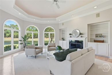 Enjoy panoramic golf course and lagoon views from this beautiful on The Landings Club - Oakridge in Georgia - for sale on GolfHomes.com, golf home, golf lot