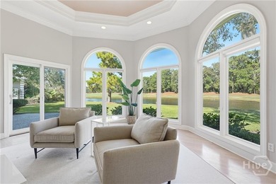 Enjoy panoramic golf course and lagoon views from this beautiful on The Landings Club - Oakridge in Georgia - for sale on GolfHomes.com, golf home, golf lot