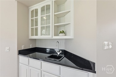 Enjoy panoramic golf course and lagoon views from this beautiful on The Landings Club - Oakridge in Georgia - for sale on GolfHomes.com, golf home, golf lot