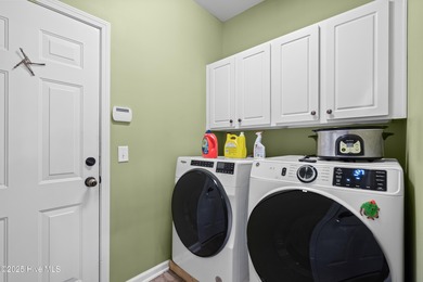 Experience the perfect blend of comfort and golf course living on Meadowlands Golf Club in North Carolina - for sale on GolfHomes.com, golf home, golf lot