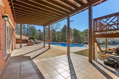 Experience luxury and convenience in this stunning lakefront on Canongate At Healy Point Country Club in Georgia - for sale on GolfHomes.com, golf home, golf lot