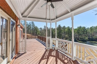 Experience luxury and convenience in this stunning lakefront on Canongate At Healy Point Country Club in Georgia - for sale on GolfHomes.com, golf home, golf lot