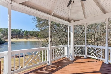 Experience luxury and convenience in this stunning lakefront on Canongate At Healy Point Country Club in Georgia - for sale on GolfHomes.com, golf home, golf lot