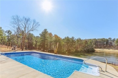 Experience luxury and convenience in this stunning lakefront on Canongate At Healy Point Country Club in Georgia - for sale on GolfHomes.com, golf home, golf lot