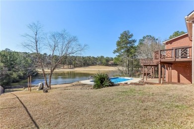 Experience luxury and convenience in this stunning lakefront on Canongate At Healy Point Country Club in Georgia - for sale on GolfHomes.com, golf home, golf lot