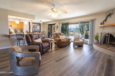 The spacious open floor plan allows you to enjoy the green on London Bridge Golf Course in Arizona - for sale on GolfHomes.com, golf home, golf lot