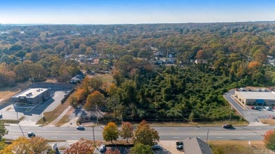 Nice land just off busy intersection with commercial potential on The Greens At North Hills Country Club in Arkansas - for sale on GolfHomes.com, golf home, golf lot
