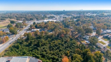 Nice land just off busy intersection with commercial potential on The Greens At North Hills Country Club in Arkansas - for sale on GolfHomes.com, golf home, golf lot