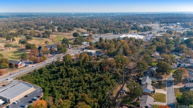 Nice land just off busy intersection with commercial potential on The Greens At North Hills Country Club in Arkansas - for sale on GolfHomes.com, golf home, golf lot