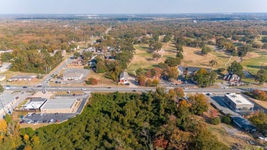 Nice land just off busy intersection with commercial potential on The Greens At North Hills Country Club in Arkansas - for sale on GolfHomes.com, golf home, golf lot