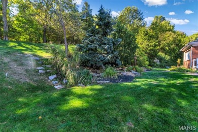 Custom ranch adjacent to the driving range in the Legends! on Country Club at the Legends in Missouri - for sale on GolfHomes.com, golf home, golf lot