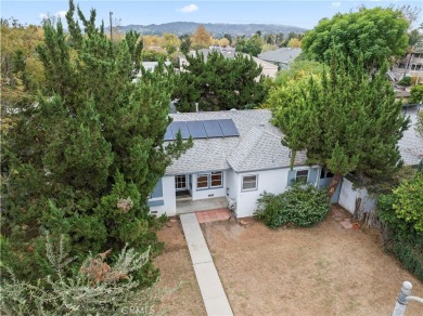 Charming single-story residence in quaint upscale neighborhood on Van Nuys Golf Course in California - for sale on GolfHomes.com, golf home, golf lot