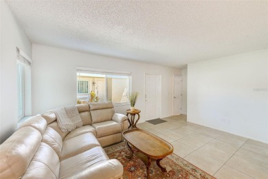 Welcome to this bright and inviting 2 bedroom, 1.5 bath, ground on Cove Cay Country Club in Florida - for sale on GolfHomes.com, golf home, golf lot