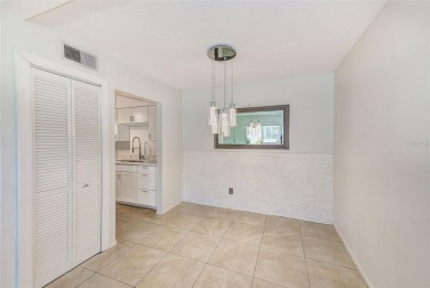 Welcome to this bright and inviting 2 bedroom, 1.5 bath, ground on Cove Cay Country Club in Florida - for sale on GolfHomes.com, golf home, golf lot