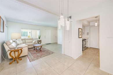Welcome to this bright and inviting 2 bedroom, 1.5 bath, ground on Cove Cay Country Club in Florida - for sale on GolfHomes.com, golf home, golf lot