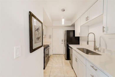 Welcome to this bright and inviting 2 bedroom, 1.5 bath, ground on Cove Cay Country Club in Florida - for sale on GolfHomes.com, golf home, golf lot