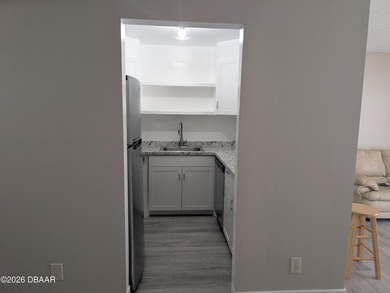 Step out your back door into the refreshing pool. Move in ready on Daytona Beach Golf Club in Florida - for sale on GolfHomes.com, golf home, golf lot