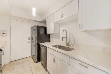 Welcome to this bright and inviting 2 bedroom, 1.5 bath, ground on Cove Cay Country Club in Florida - for sale on GolfHomes.com, golf home, golf lot
