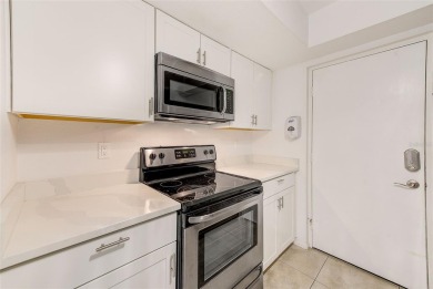 Welcome to this bright and inviting 2 bedroom, 1.5 bath, ground on Cove Cay Country Club in Florida - for sale on GolfHomes.com, golf home, golf lot